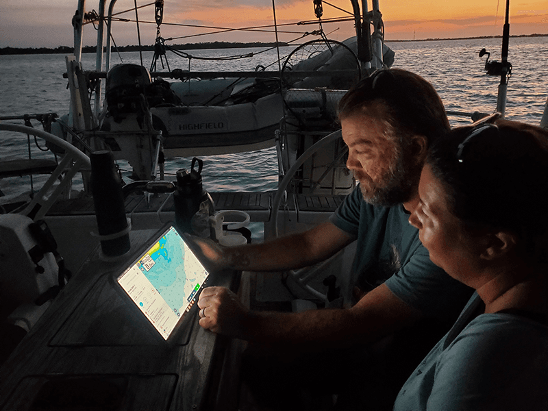 Sailor plotting the next course and navigating