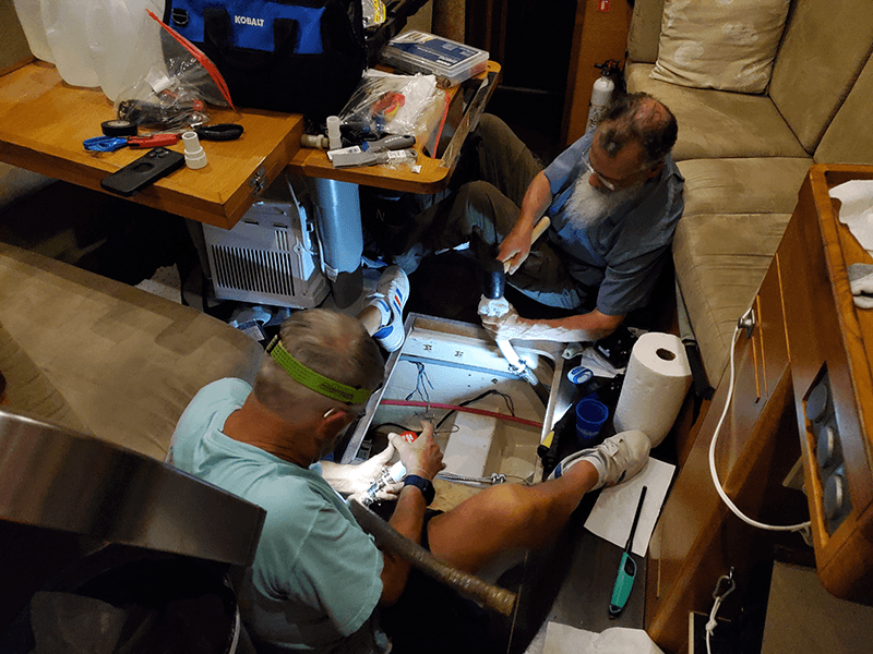 Sailors making repairs and preparing for passage